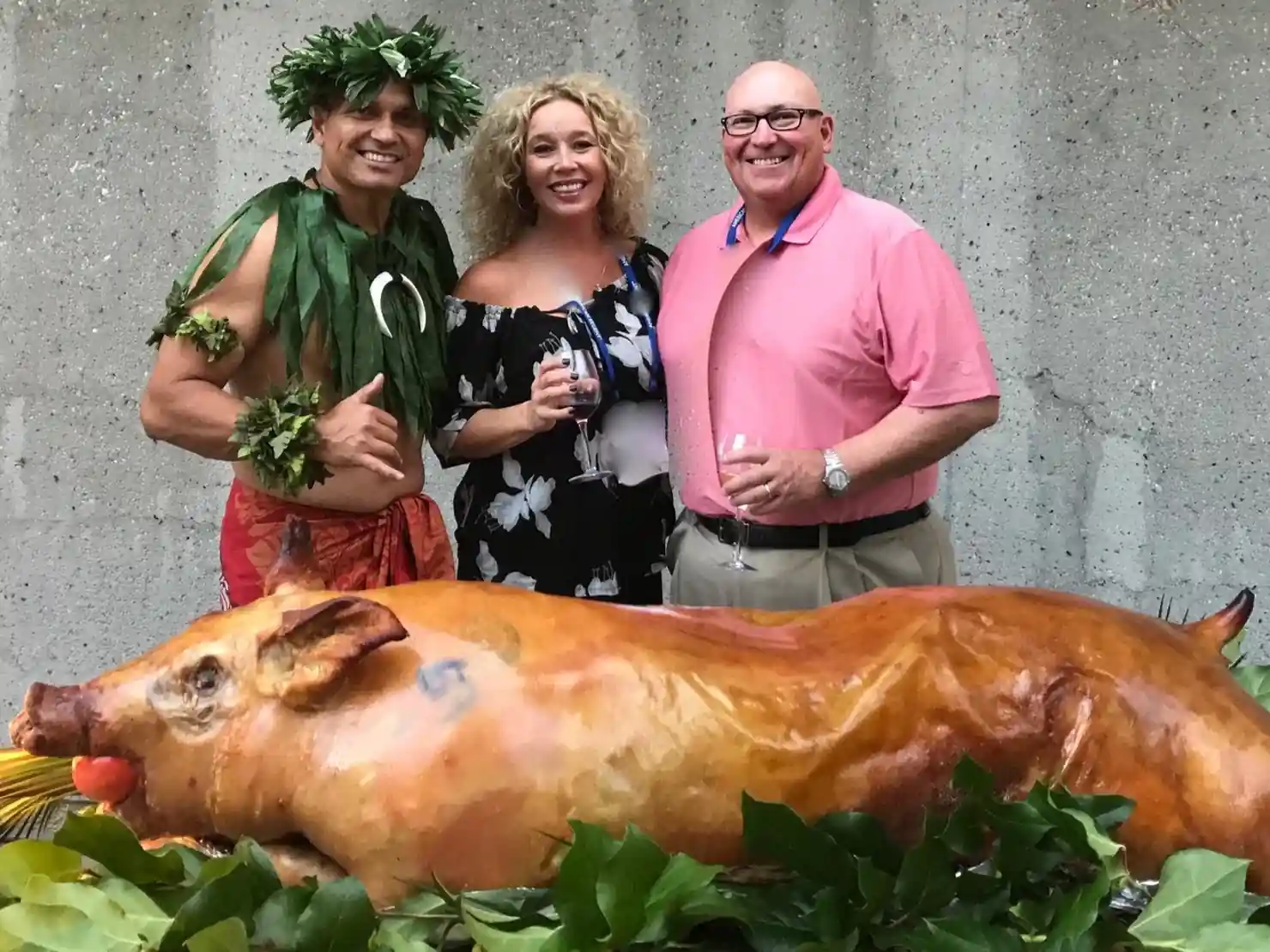 Guests Posing with Roasted Pig