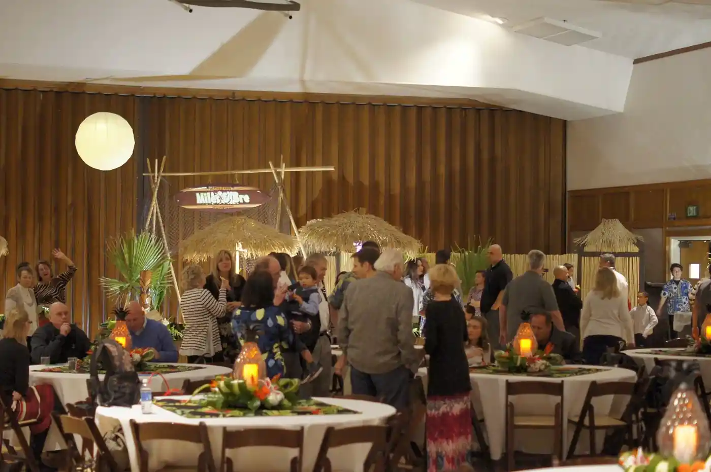 Pineapple Lantern Tables with a Bamboo Backdrop and Tiki Accents